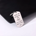 Macro detail of engraved stainless steel dog tag keychain with Thank You Dad message - Style 3 (Thank You Dad)