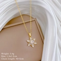 Dettaglio della collana con fiocco di neve, peso 3,4g e dimensioni 1,3x2,2cm - Ciondolo Fiocco di Neve Dorato (E346)