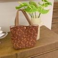 Detail of vintage corduroy tote bag with yellow floral pattern and snap button closure - Brown Daisy
