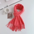 Close-up of soft pink imitation cashmere scarf with tassels on a white surface - Regular Fit / Watermelon red