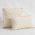 Beige velvet throw pillows with diamond quilting and pom-pom trim in square and rectangular shapes - Off-white