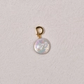 Macro shot of an iridescent flat baroque pearl pendant with a golden spring clasp - Approx 18mm Button Pearl + Gold Universal Buckle