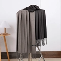 Gray and dark gray cashmere scarf with tassels hanging naturally on a display stand - No.31 Coffee Dark Grey