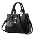 Elegante bolso de mano de cuero negro para mujer con pompones grises y detalles plateados - Negro