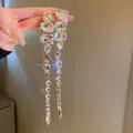 Lange Quastenohrringe mit mehrformigen Kristall-Strasssteinen und brillantem Glanz - Silberner Mehrform-Schliff Wassertropfen Quasten-Stil / Silber (Wassertropfen)