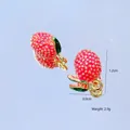 Macro detail of strawberry alloy charms with dimensions 1.2cm by 0.9cm and weight 2.9g - Lychee