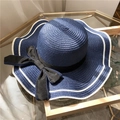 Navy blue straw sun hat with wide wavy white trim and black ribbon bow for summer - One Size / Navy Blue