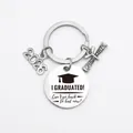 Close-up of Class of 2026 graduation keychain with engraved humorous slogan and charms - Silver (k730)