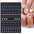 Colorful star pattern nail stickers with solid and hollow pentagram designs on model nails - STZ-X016 Multicolor Star Dots Lines