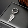 Detailed macro view of vintage silver dagger earring with rose and feather charms - Wings with Rose