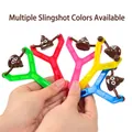 Close-up of colorful slingshot sets with funny emoji poop projectiles for stress relief - Plastic Slingshot Frame (No Poop)