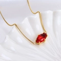Gold-plated zodiac necklace with marquise cut red stone and freshwater pearl - Taurus