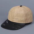 Dettaglio cappello in rafia con visiera in pelle nera e tagli a giorno decorativi - M (56-58cm) / Rafia + Tesa Nera