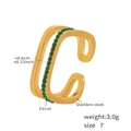 Gold stainless steel hollow ring with green zircon stones in a double-row open design - Gold Green Zirconia Style