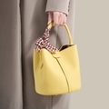 Yellow pebbled leather bucket bag with decorative silk scarf and top handle - Lemon Yellow