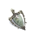 Macro detail of silver necklace with labradorite stone, pentagram and cross carvings - Labradorite
