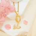 Golden tulip necklace with white cat eye stone and crystal leaves on white stone base - White Cat Eye Necklace / Gold