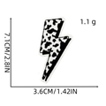Detail of lightning bolt embroidery patch with black and white cow print, 7.1x3.6cm size - Cow Print Lightning