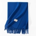 Minimalist solid Klein blue cashmere-feel scarf with fringe and brand label on white background - 70*200cm / Sapphire Blue