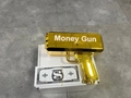 Metallic gold motorized money gun toy with play bills shown in top-down view - Gold (Money GUN) / Gold Money Gun with Money GUN + 100 Notes