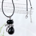 Cat pendant necklace with black oval crystals in silver alloy frame on black cord - Obsidian