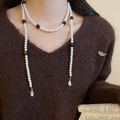 Detail of multi-layer pearl necklace with brown tiger eye beads on dark sweater - White Multi-layer Pearl Long (44#)
