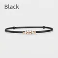 Women's black leather belt featuring a flower-shaped buckle with pearls and rhinestones - Black