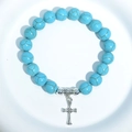 Turquoise bead bracelet featuring a silver cross pendant on a clean white background - Blue Turquoise Cross Charm