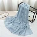 Detail of light blue chiffon scarf showing semi-transparent texture and rolled edges - 175cmx70cm / Light Blue