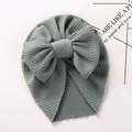 Detail of grey-green baby turban hat featuring a large bow and soft waffle knit texture - Bean Green