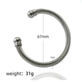 Detailed view of twisted stainless steel cuff bracelet with 67mm diameter and 7mm width - Steel