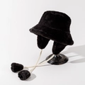 Detail of black faux fur bucket hat with ear flaps and decorative pompom drawstrings - M (56-58cm) / Black
