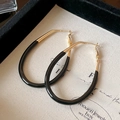 Macro shot of large two-tone hoop earrings with gold metal and black contrast details - 41# Silver Earring Post - Gold - Black - Diameter 42mm