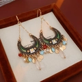 Close-up of bohemian crescent moon drop earrings with enamel detail and colorful beads - Green Moon Water Drop Style