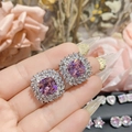 Macro shot of 18K gold plated bow earrings with square cut pink zircon and halo crystals - 0044 Large Pink Purple Double Halo Studs