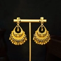 Detailed view of gold teardrop tassel earrings with bohemian ethnic style on a stand - Gold Pear Bead Tassel