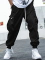 Detail of black cargo joggers featuring multiple pockets and white drawstring waist cord - M / Bottoms / Black