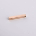 Macro view of 3D rose gold stainless steel bar pendant with hole for custom DIY engraving - Rose Gold