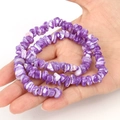 Detailed close-up of handmade irregular purple shell beads with natural white textures - Irregular Purple