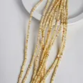Flat round disc beads made of natural shell in creamy yellow for DIY jewelry making - 4mm / Light Yellow