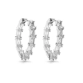 Detail of silver hoop earrings featuring baguette-cut cubic zirconia in a pave setting - Style B Pair / White Gold