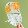Handmade crochet lily bouquet with yellow and orange flowers on a white card - Cosmos (Yellow + Orange Combo)