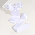 Detail of elegant white silk bow hair clip with long ribbons on a wavy backdrop - White