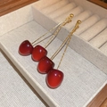 Detail of red acrylic cherry earrings with gold tassels in a beige velvet jewelry box - 24# Silver Needle - Red - Cherry