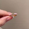 Pink enamel square zircon open ring in golden finish held by hand on beige background - Light Pink
