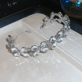 Detail of silver bracelet with crystal butterfly charms inside a beige jewelry gift box - Silver Bracelet-Butterfly Petal(9#)