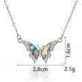 Detailed macro view of silver butterfly pendant with shell inlay and cubic zirconia - Silver Dreamy Butterfly Shadow Necklace