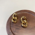 Macro shot of gold-plated thick chain link earrings on a dark wood tray display - 25# Gold Modern Chain Linked Hoop Style (25# Silver Earring Post-Gold-Chain-Real Gold Plated)