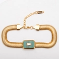 Goudkleurige roestvrijstalen slangenarmband met malachietsteen en ingelegde zirkoon - Armband / Donkergroen met korte zwarte lijnen