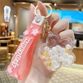 Pink liquid glitter keychain with Happy Day wrist strap and flower charm charm - Pearl Sakura - White